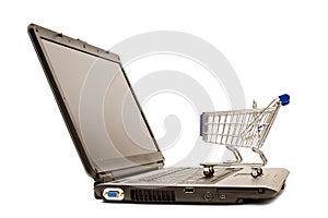 Mini shopping cart on laptop