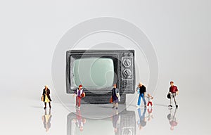 Miniature television and miniature people.