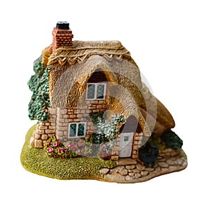 Miniature thatched cottage home in quaint english village