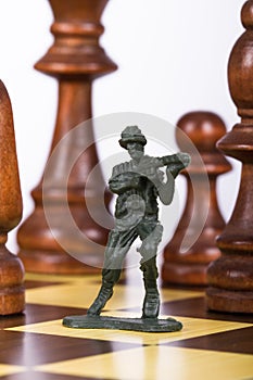 Miniature Toy Soldier on Chess Board