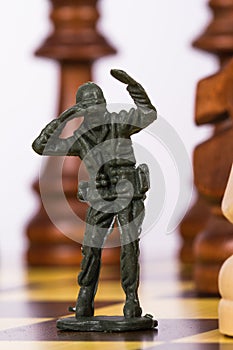 Miniature Toy Soldier on Chess Board