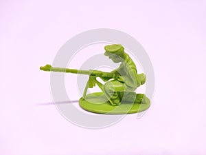 Miniature toy soldier on white background, close-up
