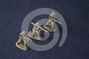 Miniature toy soldiers. Plastic toy military men at war.