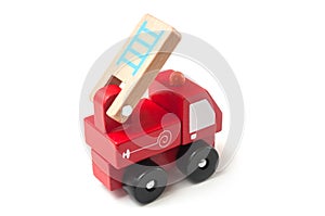 miniature toy, wooden fire truck on white background