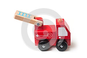 Miniature toy, wooden fire truck on white background