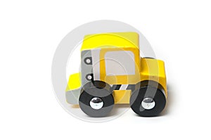 miniature toy, wooden yellow car on white background