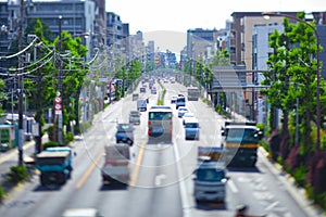 A miniature traffic jam at the avenue daytime in the downtown tiltshift