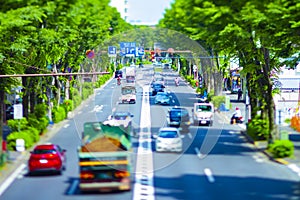 A miniature traffic jam at the avenue daytime in the downtown tiltshift photo