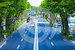 A miniature traffic jam at the avenue daytime in the downtown tiltshift photo