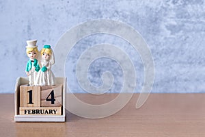 Miniature Wedding couple with wooden calendar 14 february. Valentine s day