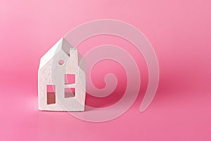 Miniature white toy house on pink pastel background Trendy Background Property Insurance dream home concept copy space