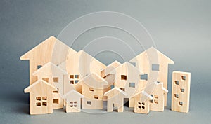 Miniature wooden houses. Real estate. City. Agglomeration and urbanization. Real Estate Market Analytics. Demand for housing. photo