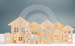 Miniature wooden houses. Real estate. City. Agglomeration and urbanization. Real Estate Market Analytics. Demand for housing.