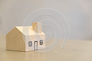 Miniature wooden houses on the table.