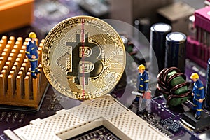 Miniature worker cutting bitcoin , halving concept
