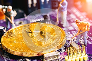 Miniature worker dig gold bitcoin miner