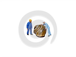 Miniature workmen inspecting snail shell isolated on white.