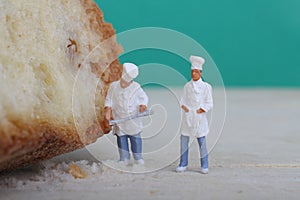 Miniatures of cooks with bread