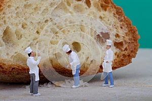 Miniatures of cooks with bread