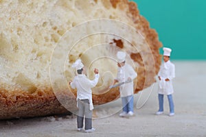 Miniatures of cooks with bread