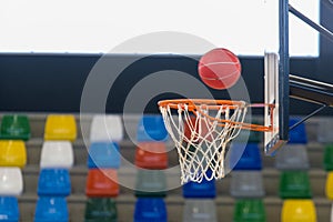 Detail of a basketball about to enter the basket photo