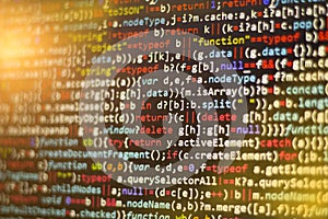 Minificated javascript code. Computer programming source code abstract screen of web developer.