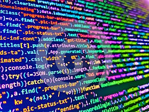 Minificated web development javascript code close up in sunset rays. Software background technology. Software source code.