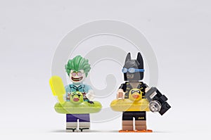 Lego vacation joker and batman minifigures isolated on white background