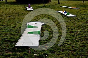 minigolf course in park catch golf balls behind obstacle. game for