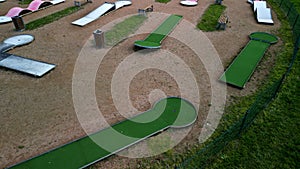 minigolf course in park catch golf balls behind obstacle. game for points