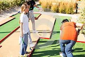 Minigolf player detail on green grass. High quality photo