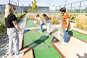 Minigolf player detail on green grass. High quality photo