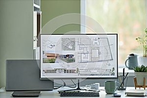 Computer with 3D blueprints on screen