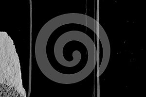 Minimal black background with thin white vertical scratches creating linear distressed texture.