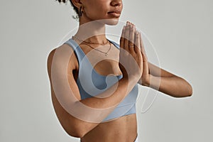 Close Up of Black Young Woman Meditating with Eyes Closed in Yoga Studio