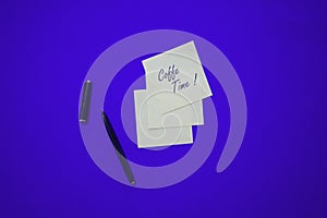 Minimal composition on a colorful pastel background with word `Coffee Time` writen on the little paper