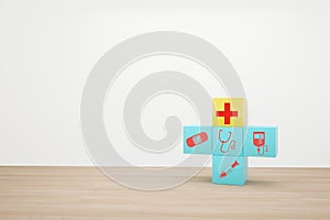Minimal concept idea about of health and medical insurance, arranging block color stacking with icon healthcare medical on wooden