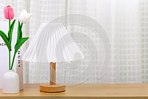 Minimal concept of living room interior,lamp and tulip on wood table