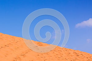 Minimal desert landscape background scenic view diagonal horizon background of yellow sand dune foreground and blue sky space