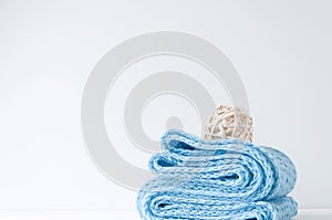 Minimal elegant composition with blue scarf and rattan ball