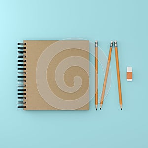 Minimal flat lay : Top view of sketchbook and orange pastel pencil , rubber on blue pastel paper background. Minimal Concept.