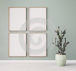 Minimal frame mock up design, succulent plant. four wooden frames on pastel green wall