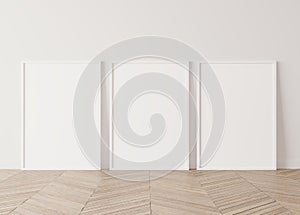 Minimal frame mock up interior, Three white vertical frames Standing on parquet floor