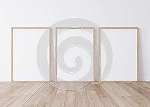 Minimal frame mock up interior, Three wooden vertical frames Standing on parquet floor with white background