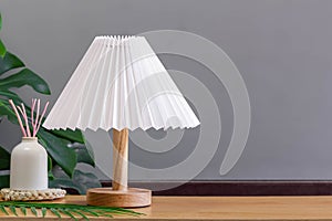 Minimal lamp on wood table.concept copy space