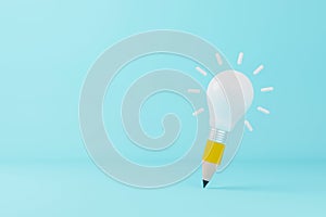 Minimal light bulb and pencil on light blue background