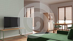 Minimal living and dining room in white and green tones. Velvet sofa, wooden table with chairs, cabinets and partition wall.