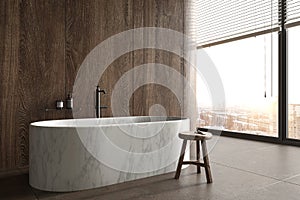 Minimal luxury bathroom with city view. Stone floor, wood tile wall and modern marble bathtub. Interior have large