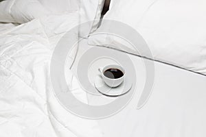 Minimal mornings with a cup of coffee in bed