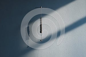 Minimal Pendulum On Blue Wall Balance Concept